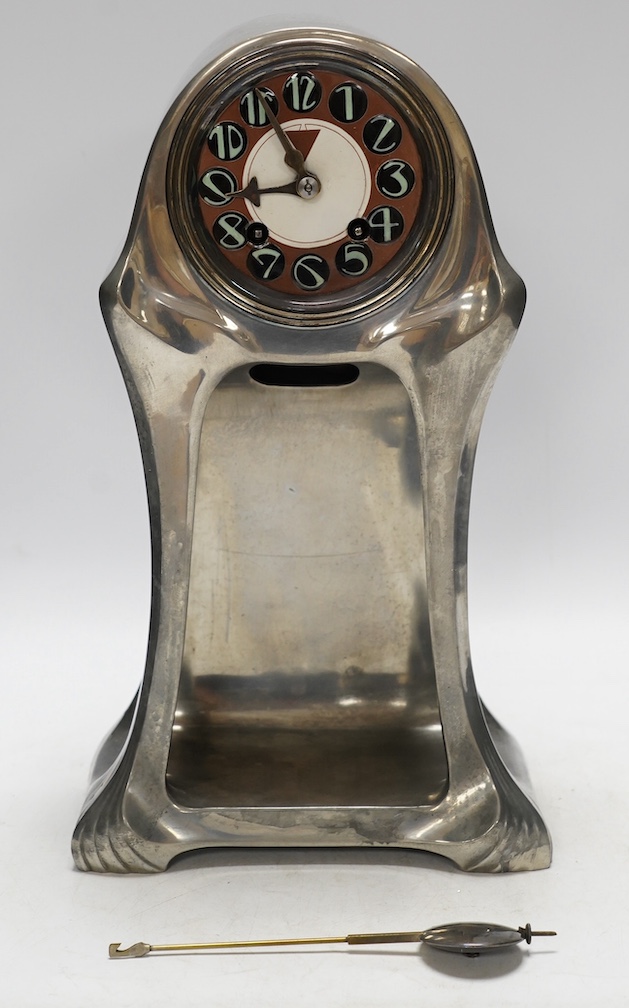 An Orivit Secessionist design pewter mantel clock, c.1905, enamelled dial and French drum shaped movement, 35cm high x 20cm at base. Condition - good